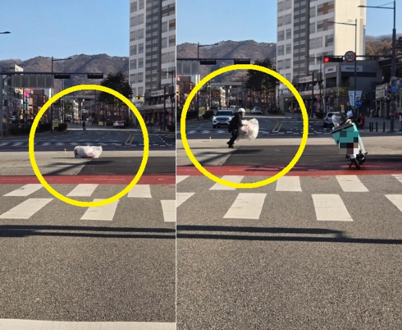 배달기사가 도로 위에 떨어져 있는 큰 쓰레기를 치우는 장면이 목격돼 훈훈한 감동을 줬다. [사진=보배드림]