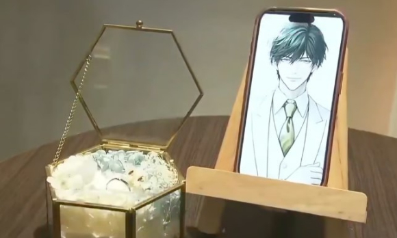 카노가 디지털 결혼식을 위해 증강현실 안경을 쓰고 있는 모습 [사진=SCMP, X 캡처]