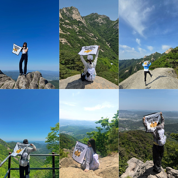 지난 13일 순천만국가정원에서 열린 '르무통 산책회 in 순천' 참가자들이 녹음을 배경으로 활기차게 걷고 있다. [사진=르무통]